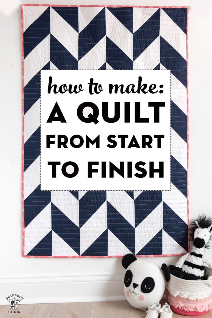 a black and white wall hanging with the words how to make a quilt from start to finish