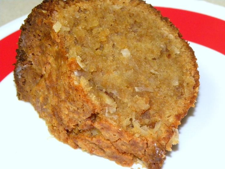 a piece of cake sitting on top of a white and red plate