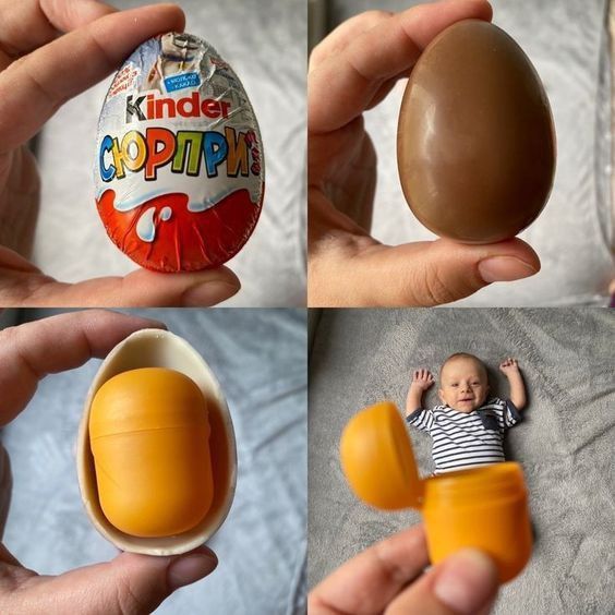 an egg shell is being held in front of a baby's face and hands