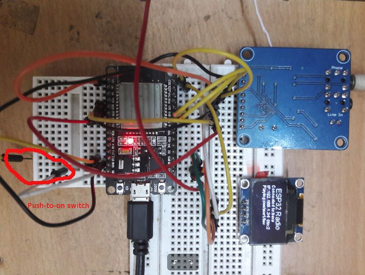 an electronic device is connected to wires on a board