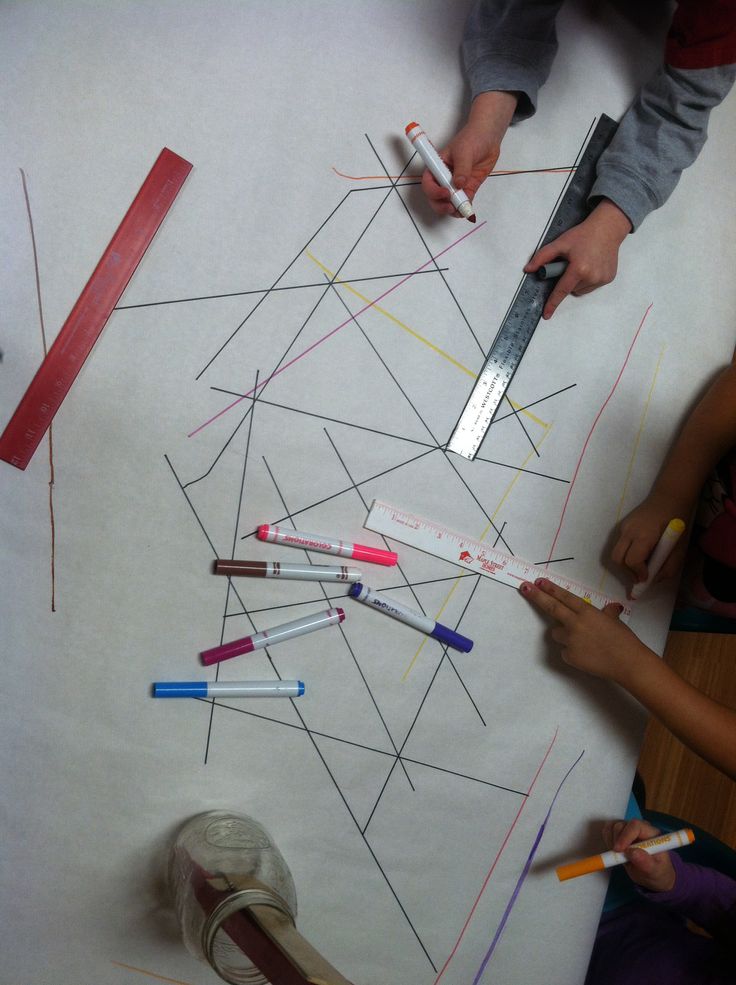 children are making art with crayons and pencils on the paper that is cut into triangles