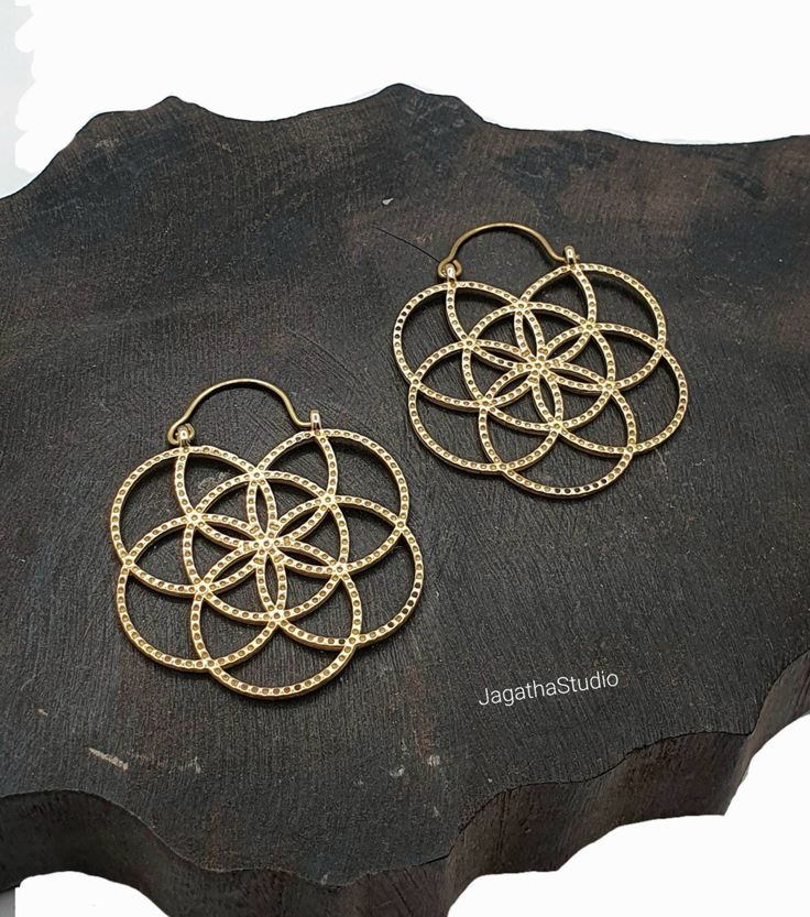 HANDMADE Beautiful Ethnic sacred geometry flower of life hoop earrings. The Flower of Life is a sacred power symbol of the connections life weaves through all beings. It is believed to contain the patterns of creation and fundamental forms of space and time.  Beautiful detailed handmade earrings , ideal for any look. SIZE Aprox Length: 5 cm Aprox width: 4.3 cm Handmade with high quality hypoallergenic Jewelery brass, nickel free. Please follow the link to view my shop for other beautiful pieces. Spiritual Hoop Earrings For Festivals, Spiritual Hoop Earrings, Sacred Geometry Flower Of Life, Hippie Chic Jewelry, Sacred Geometry Jewelry, Boho Hoop Earrings, Large Statement Earrings, Beautiful Anklet, Statement Hoop Earrings