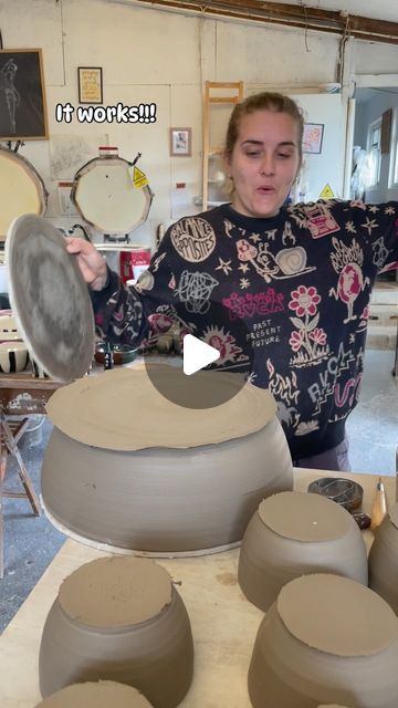 a woman is making pottery on a potter's wheel