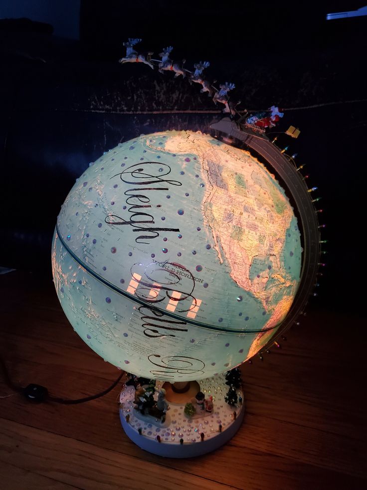 an illuminated globe with writing on it