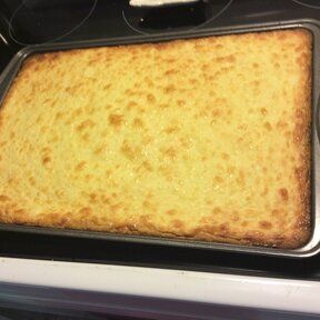 a pan filled with food sitting on top of a stove