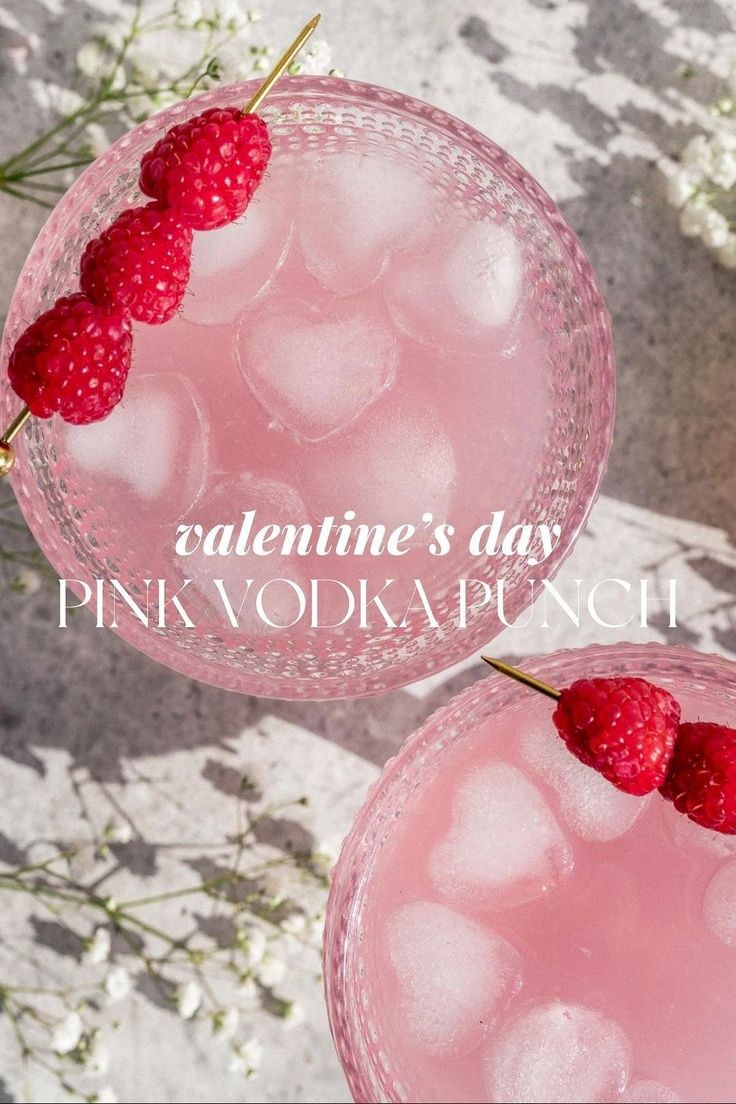 two glasses filled with ice and raspberries on top of each other, next to the words valentine's day pink vodka punch