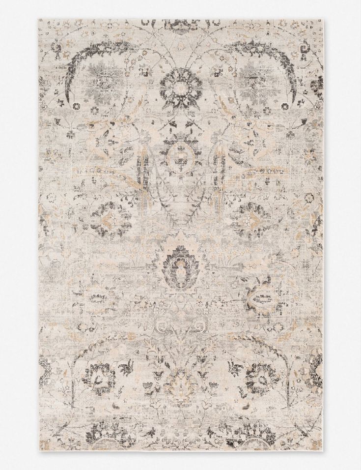 an area rug with various colors and patterns on it, including beiges, browns, grays