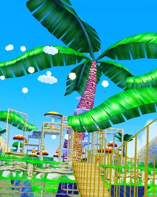 an animated image of a palm tree and roller coasters