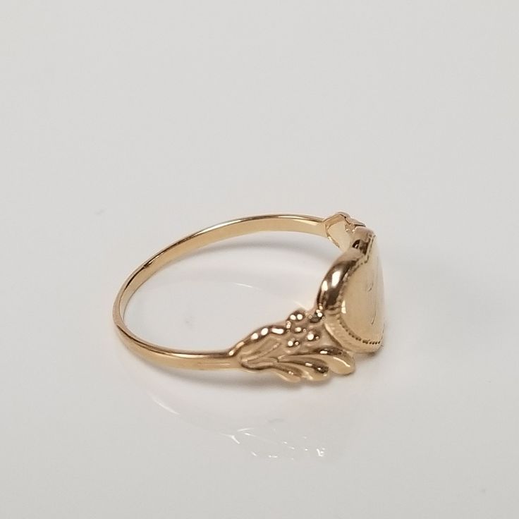 "Thanks for shopping our vintage estate store. We tend to sell well below wholesale and truly hope you enjoy all of our items. Many of the items are one of a kind, so please enjoy scrolling through the pictures and hopefully something will catch your eye. Brown spots are from camera or reflections. Estate 14k yellow gold monogram cursive capital V heart ring. Custom made ring for our shop. Ring size: 3 Setting: 7.5mm 1/4\" to 3/8\" Band width: 1.4mm Weight: .90 gram Marked 14k and it's sweet. On Oval Antique Signet Ring As Gift, Antique Oval Signet Ring For Gift, Gold Signet Ring With Polished Finish For Collectors, Vintage Tarnish-resistant Signet Ring, Victorian Yellow Gold Rings With Polished Finish, Gold Engraved Signet Ring Collectible, Personalized Engraved Yellow Gold Ring For Collectors, Antique Yellow Gold Round Signet Ring, Vintage Gold Engraved Signet Ring