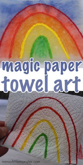 a paper towel with the words magic paper towel art on it and a rainbow painted in white