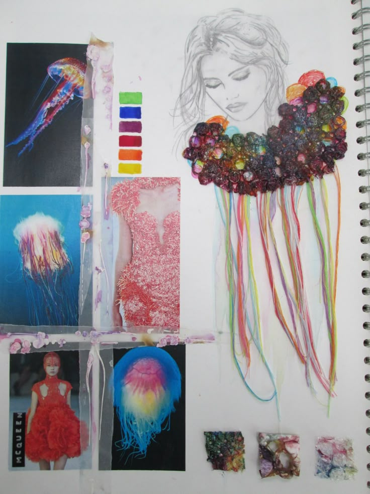 an open notebook with pictures and art supplies on the pages, including jellyfishs