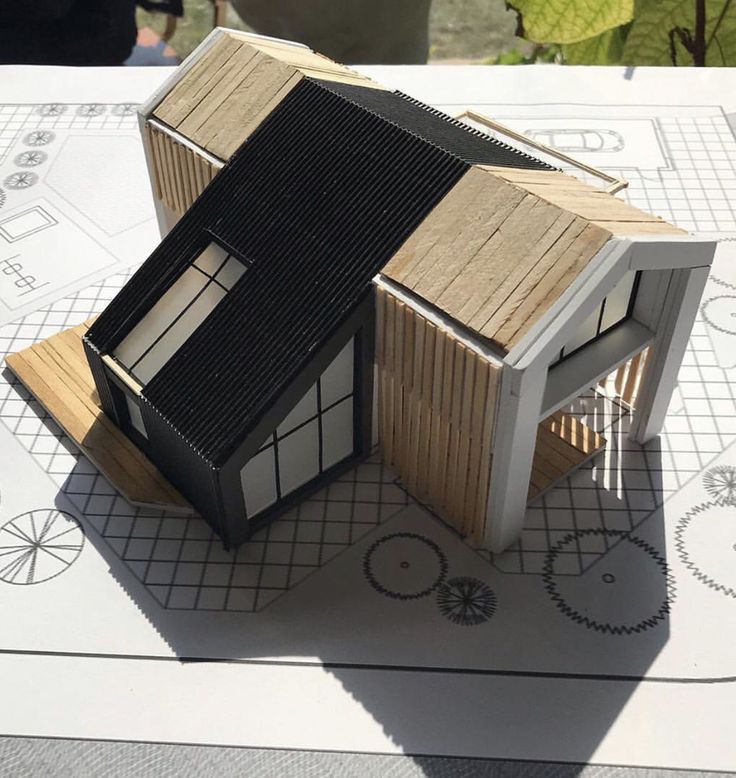 a model of a house sitting on top of a table