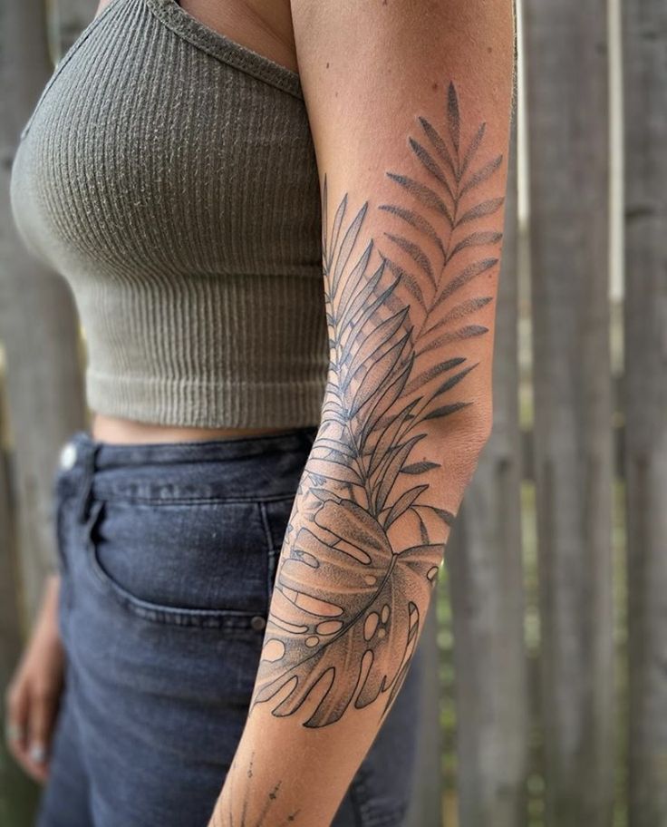 a woman with a tattoo on her arm