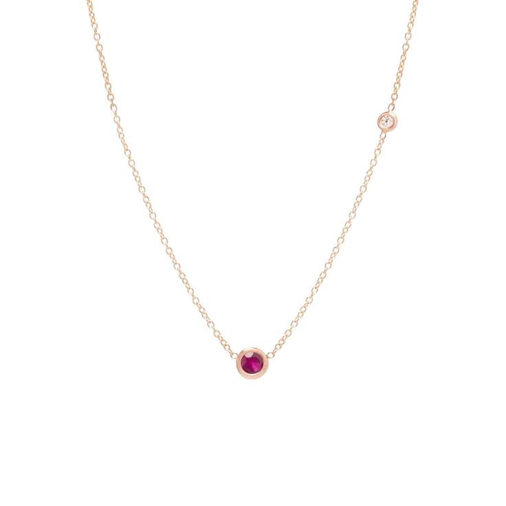 14k gold chain necklace with a single bezel set round ruby and an off-set round white diamond SPECIFICS • 14k cable chain adjustable at 14-15-16"• ruby stone is 3mm, diamond is 2mm• white diamond .03ctw Elegant Ruby Necklace With Delicate Chain, 14k Gold Bezel Setting Necklace, Fine Jewelry Ruby Necklace With Single Cut Diamonds, Ruby Necklace With Single Cut Diamonds, Formal Ruby Necklace With Bezel Setting, Red Diamond Bezel Setting Jewelry, Red Diamond Jewelry With Bezel Setting, Fine Jewelry Ruby With Bezel Setting, Red Round Pendant Jewelry With Bezel Setting