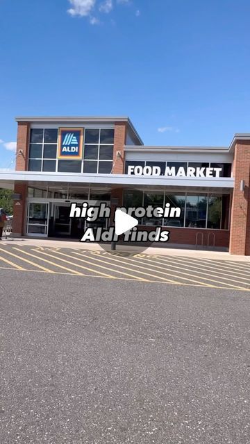 an empty parking lot in front of a food market