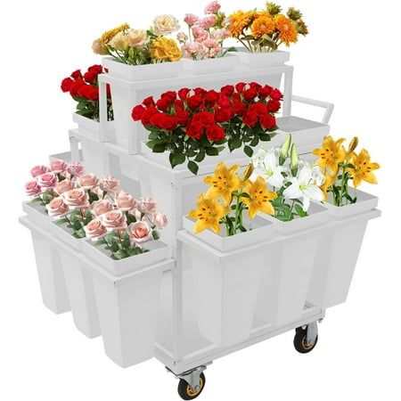 four plastic containers with flowers in them on wheels