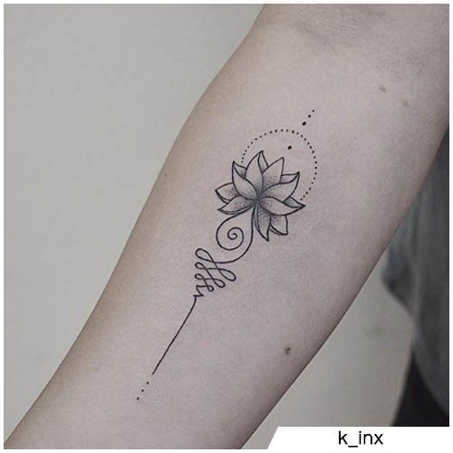 a woman's arm with a flower tattoo on the left side of her arm