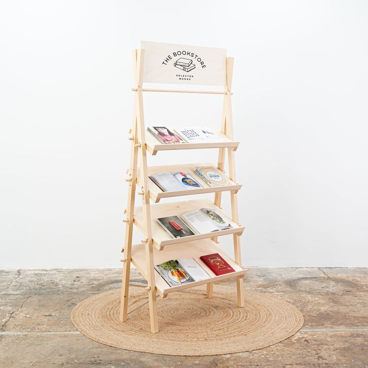 a wooden book stand with books on it