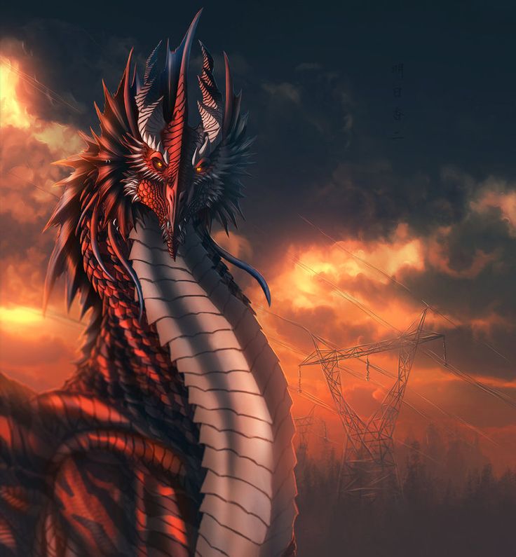 a red and black dragon sitting on top of a hill