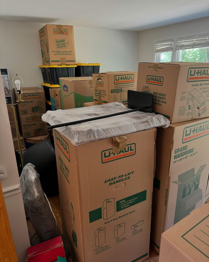 boxes stacked on top of each other in a room