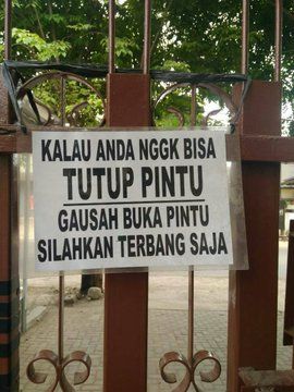 a sign posted on a gate stating that it is not allowed to enter this area