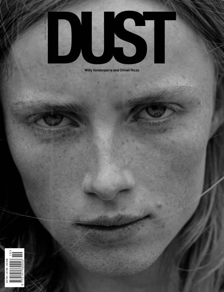 a woman with freckled hair on the cover of dust magazine