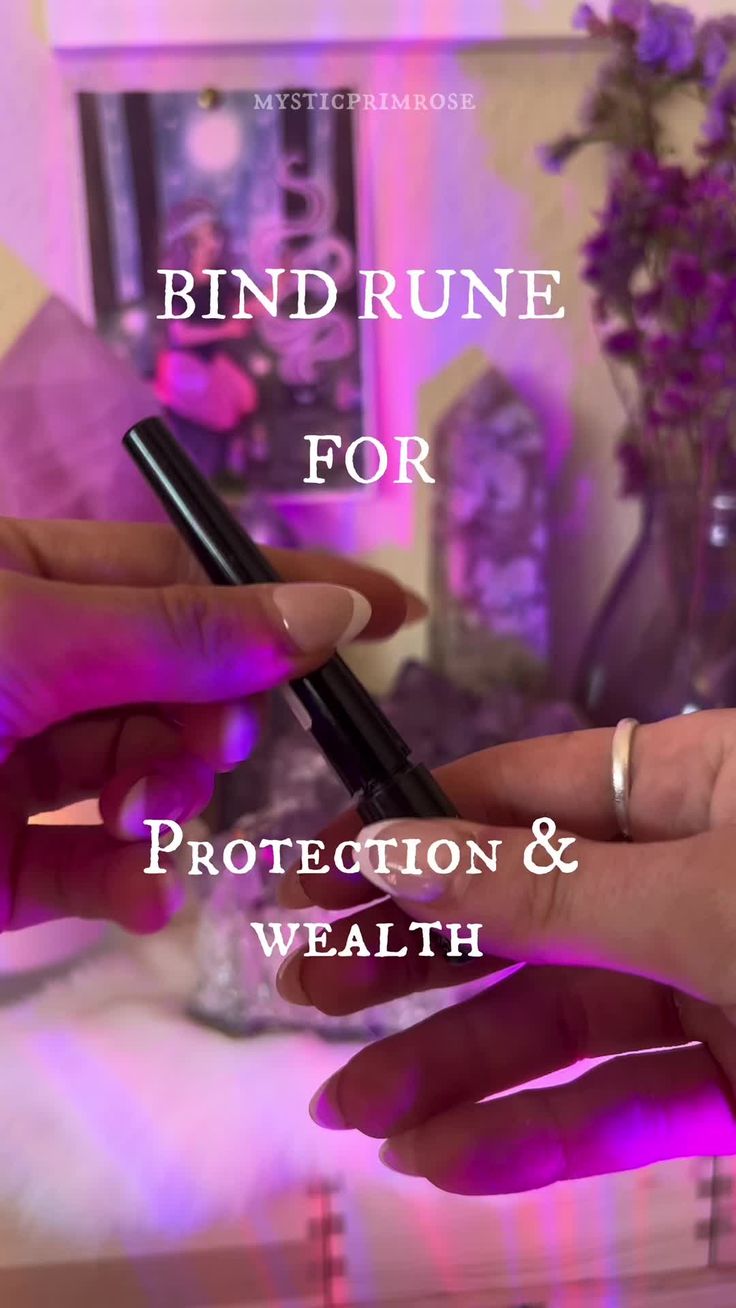 two hands holding an electronic device with the words bind rune for protection and health