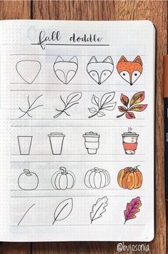 an open notebook with drawings of fall leaves, pumpkins and other things on it