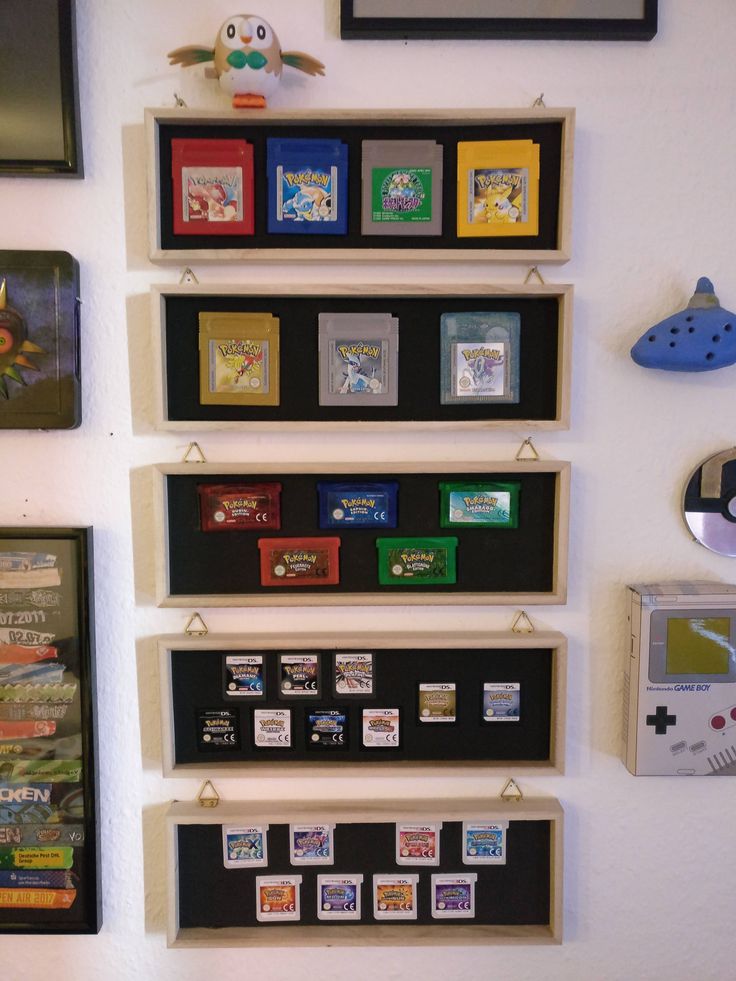 there are many different items on the wall in this room, including video games and magnets