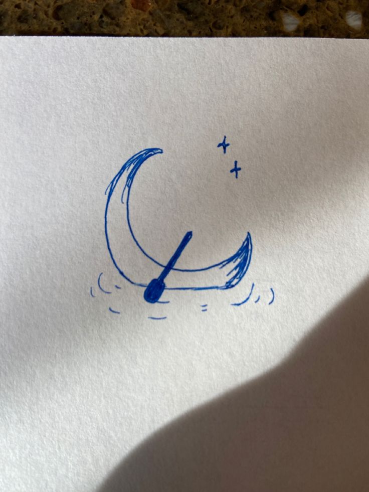 a piece of paper with blue ink that has a drawing of a boat on it