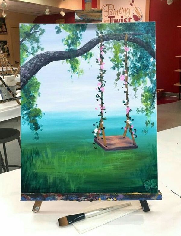 an easel with a painting of a swing on it