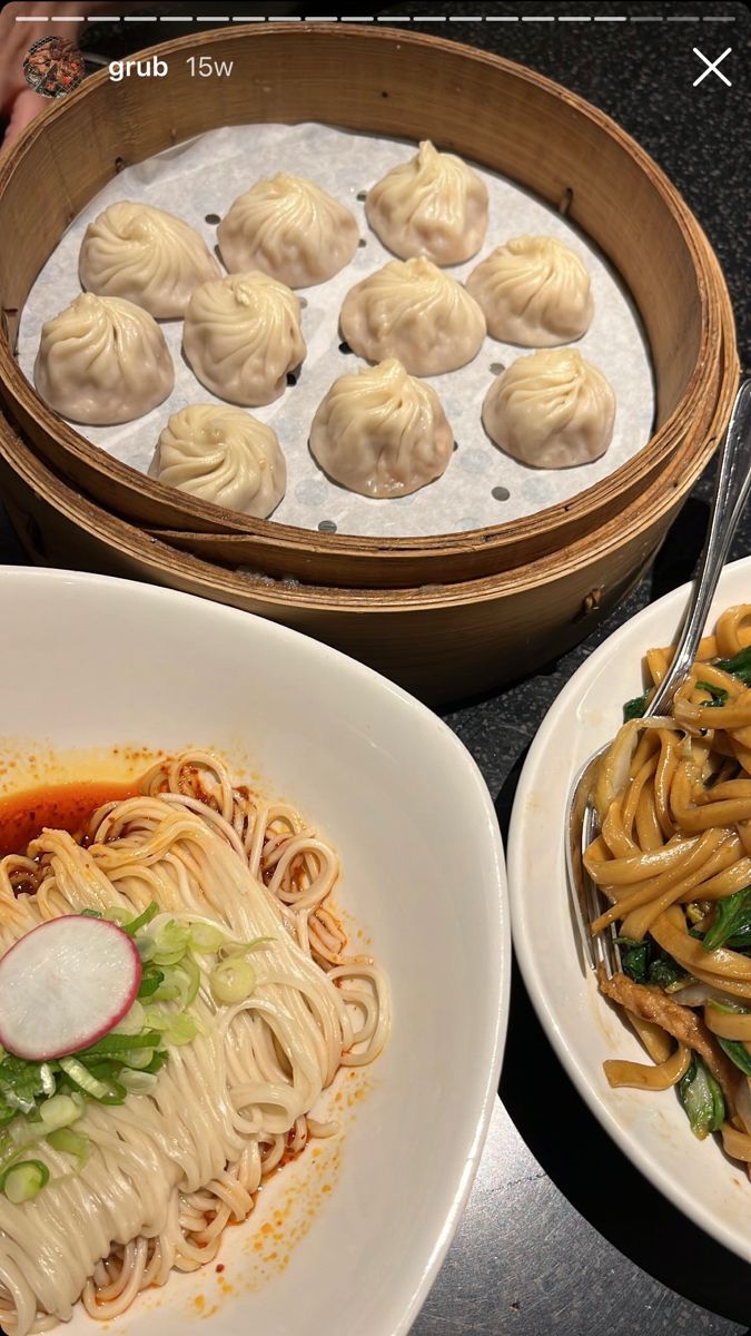 several plates of food on a table with chopsticks