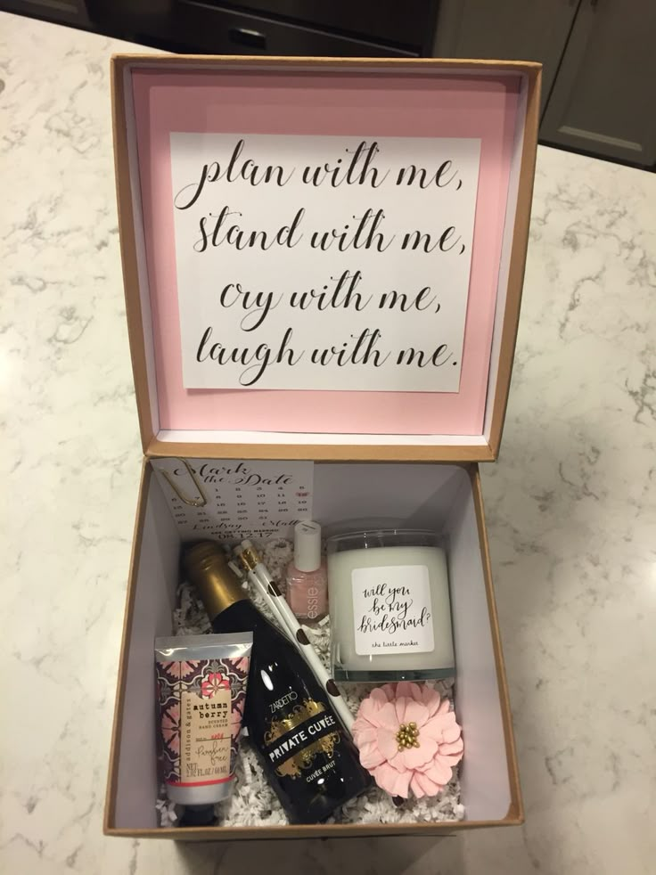 an open box with various items inside on a counter top next to a sign that says, plan with me stand with me cry with me laugh with me laugh with me