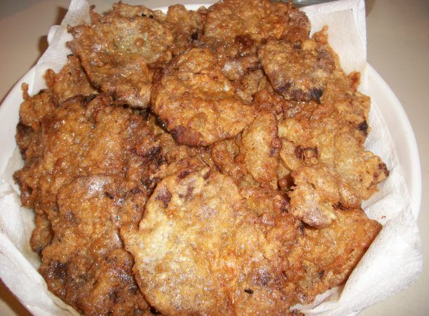 some fried food in a white bowl on a table