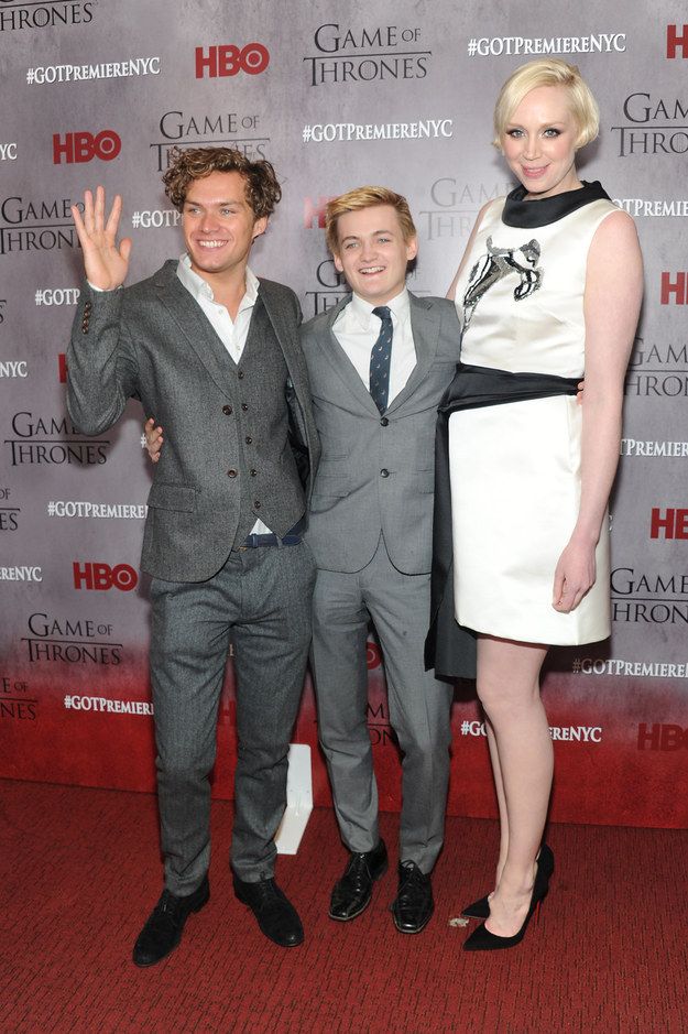 two men and a woman are posing for the camera at game of thrones event