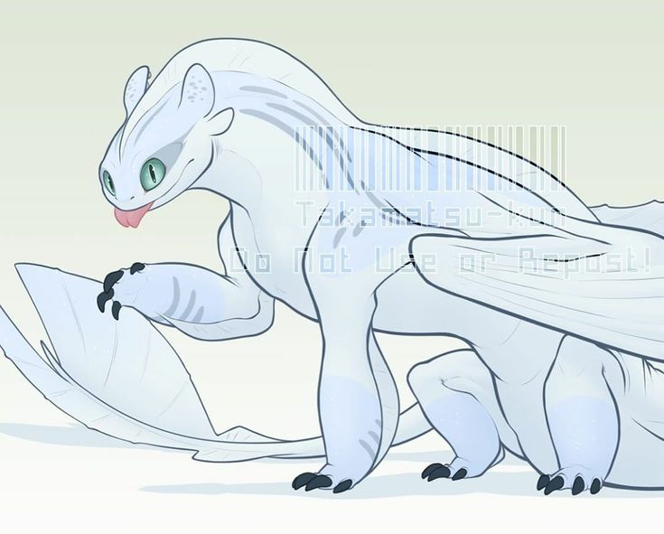 a white dragon with green eyes standing next to a piece of paper in its mouth