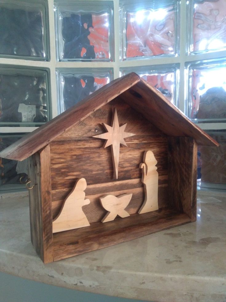 a wooden nativity scene with the birth of jesus