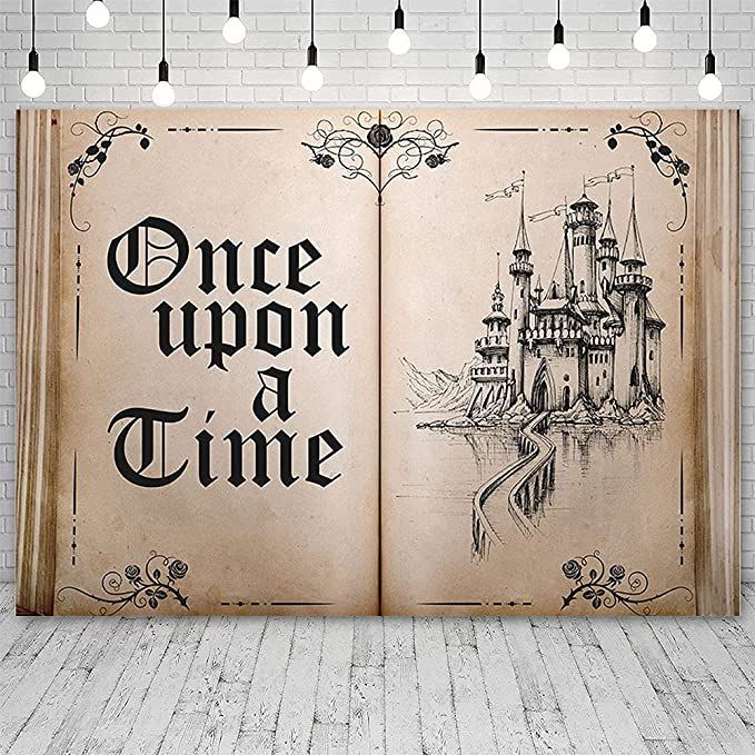 an open book with the words once upon a time written on it in black ink