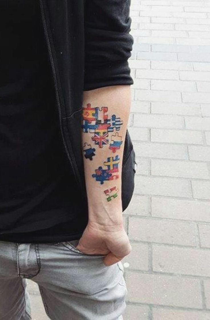 a man with a colorful tattoo on his arm