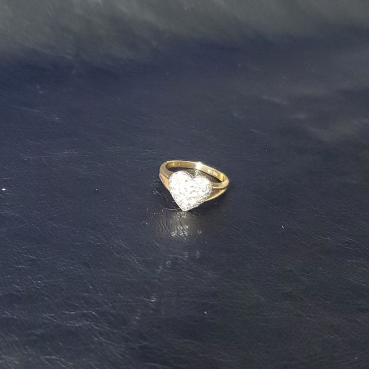 15 Round Diamonds Set In 14k White Gold On A 14k Yellow Gold Heart Shaped Ring. The Ring Size Is 4 - 4 1/2. Band Shows Some Wear. 2.4 Grams Total Weight Heart-shaped 14k Gold Diamond Ring, Gold Heart-shaped Rings With Hallmark, Luxury Yellow Gold Heart-shaped Rings, Valentine's Day Yellow Gold Heart Ring With Charm, Gold Heart-shaped Diamond Ring For Valentine's Day, Round Diamond Setting, Heart Shaped Rings, Heart Shaped Diamond, Diamond Heart