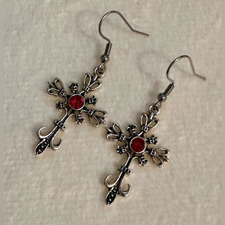 Silver Cross With Red Crystal Earrings Gothic Vampire Cross *Brand New. *Zinc Alloy Cross Charm. *Stainless Steel Earrings Hooks.(Backs Included). Style:Gothic,Punk, Retro, Coquette, Glam, Boho, Casual. Occasion: Party, Festival, Casual, School, Work. #Vampire#Cross#Earrings #Women#Unisex Vampire Earrings Aesthetic, Vampire Goth Accessories, Red And Silver Jewelry, Vampire Earrings, Vampire Jewelry, Retro Coquette, Glam Boho, Earrings Gothic, Jewelry Gothic