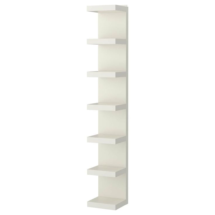 a white book shelf with five shelves on each side