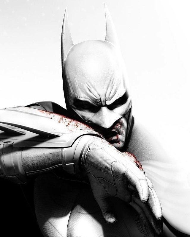 a black and white photo of batman with his hands on his chest, leaning against the wall