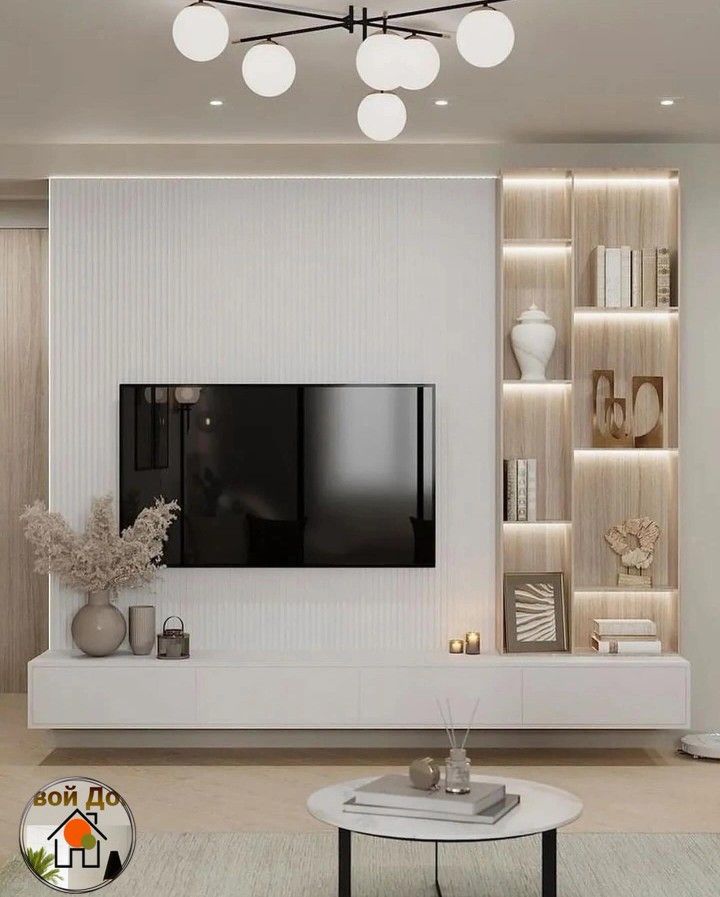 a modern living room with white walls and wooden shelves on either side of the tv