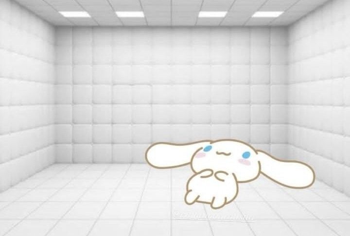 an empty room with a cartoon bunny in the middle and blue eyes on it's face