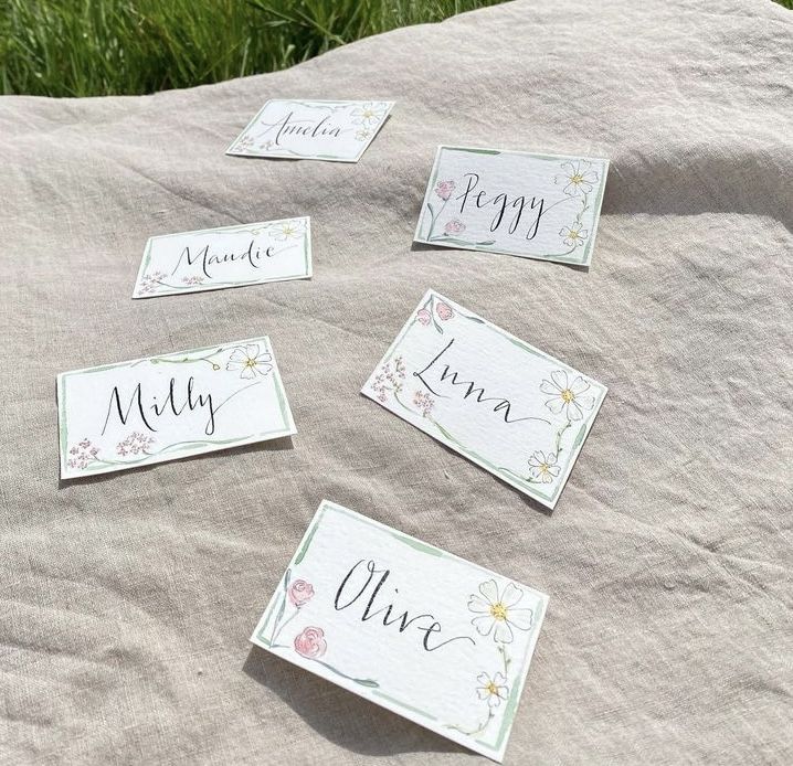 four place cards are placed on top of a blanket