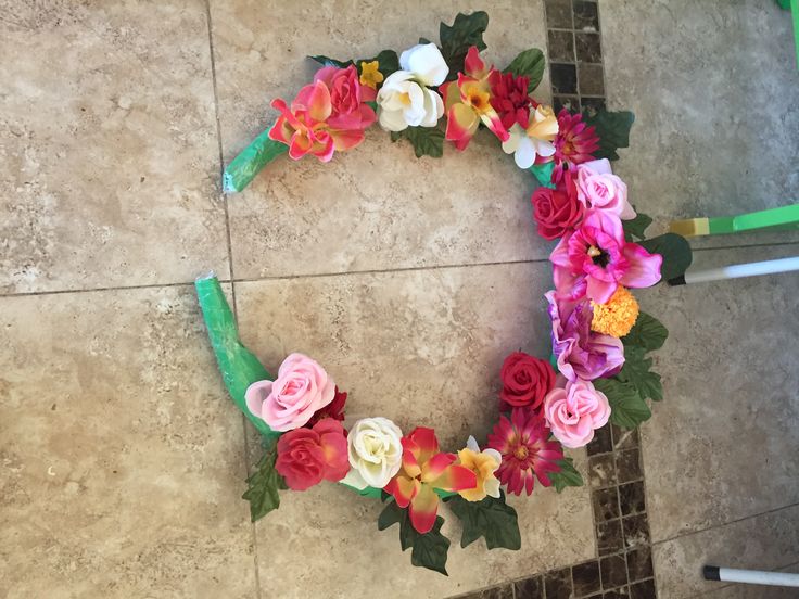 a wreath made out of flowers on the ground