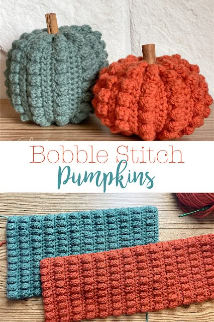 two crocheted pumpkins sitting next to each other