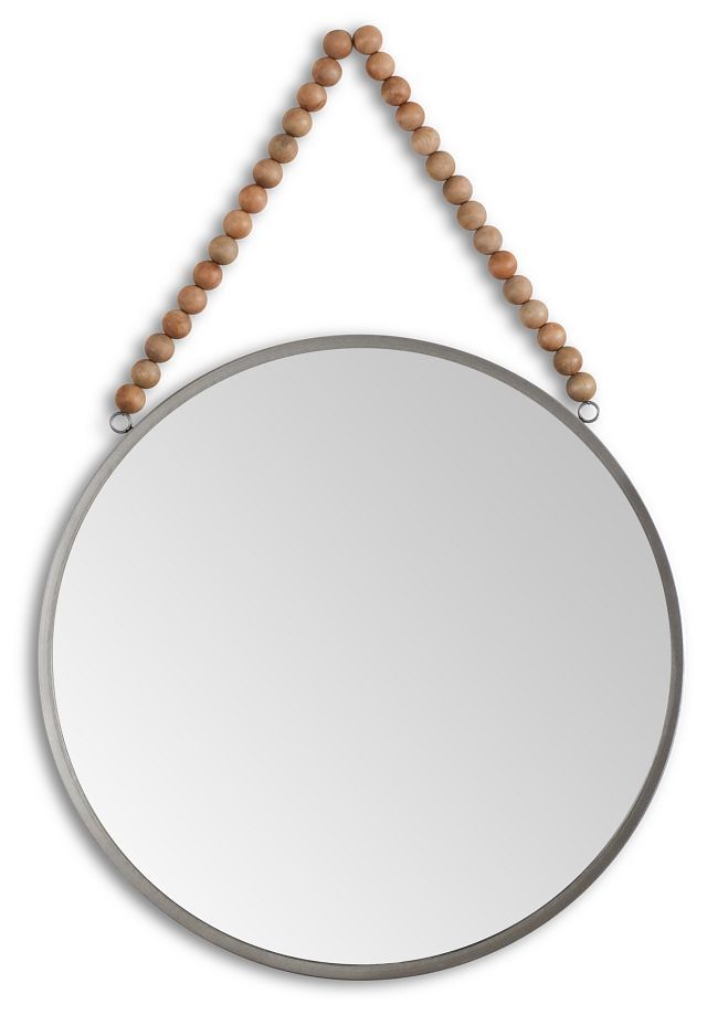 a round mirror hanging on a beaded string