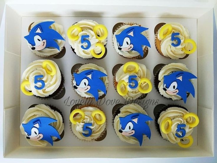 the cupcakes are decorated with blue and yellow frosting sonic the hedgehog characters